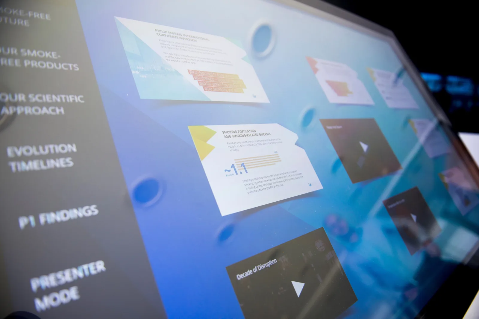 Close-up of a digital touchscreen displaying various data and graphics.